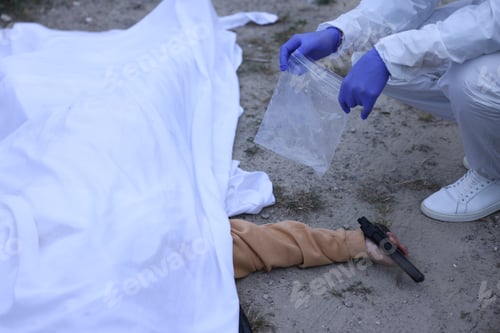 Preview: Forensic expert working at crime scene with dead body outdoors, closeup