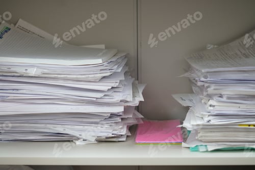 Preview: Documents and papers in a pile, documents in an office