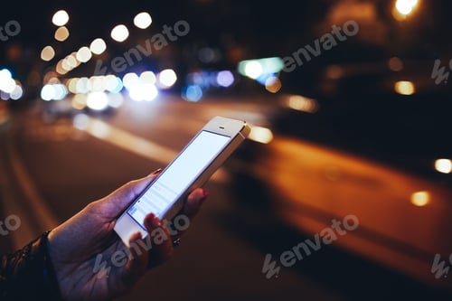 Preview: Unrecognizable woman surfing cellphone at night