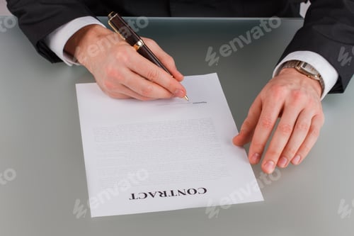 Preview: Male entrepreneur signing business contract.
