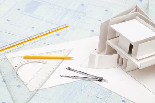 Preview: Architectural model and other office stationery on blueprint