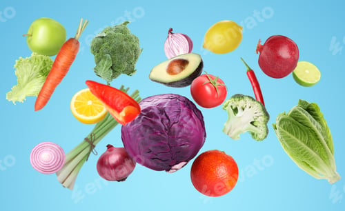 Preview: Many fresh vegetables and fruits falling on light blue background