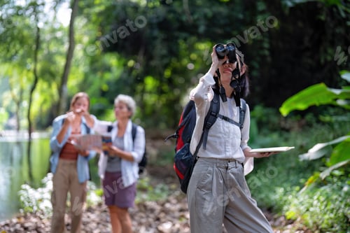 Preview: Backpack tourist travel outdoor adventure bird study using binoculars looking and record to book
