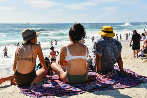 Preview: A trio of millennial friends enjoy a beautiful, sunny afternoon at the beach.