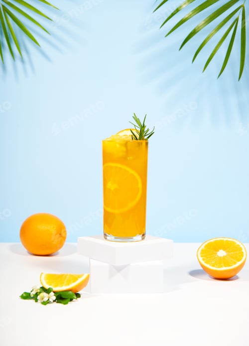 Preview: Glass of 100% Orange juice with orange slices fruits on pastel color background.