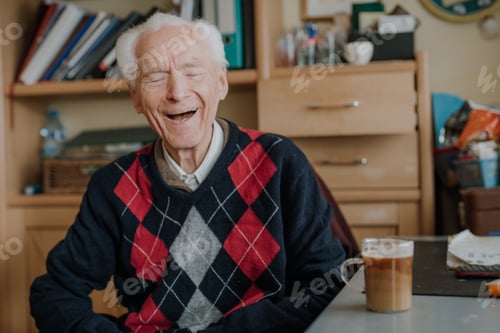 Preview: Portrait of happy senior drinking coffee