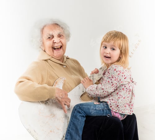 Preview: little girl on geatgrandmother knees having fun