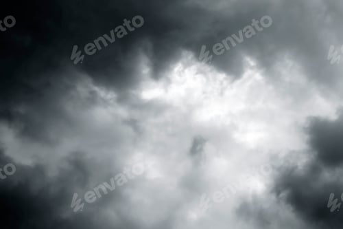 Preview: Dramatic stormy sky background. Dark fluffy cloudy sky.