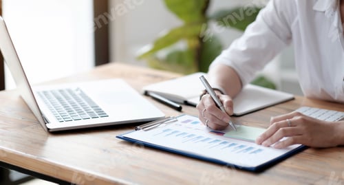 Preview: Close-up, An Accountant or business owner writes on sticky notes, takes notes on post notes, works