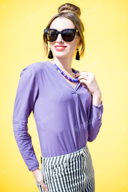 Preview: Woman portrait on the yellow background outdoors
