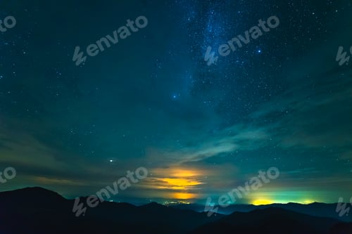 Preview: The picturesque clouds above mountains. evening night time.