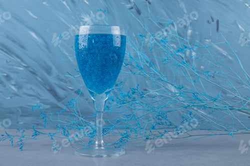 Preview: A glass of fresh blue cocktail on grey background
