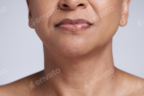 Preview: Beauty, skincare and lips of senior woman isolated in studio for wellness, healthy and natural skin