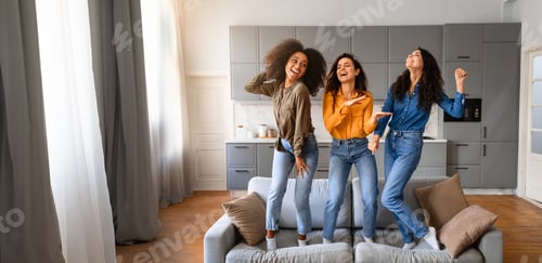 Preview: Three friends joyfully dancing together in a modern living room setting