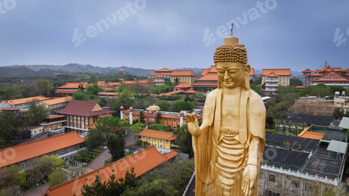 Preview: Majestic Buddha statue at Fo Guang Shan Buddha Complex in Taiwan surrounded by serene landscape