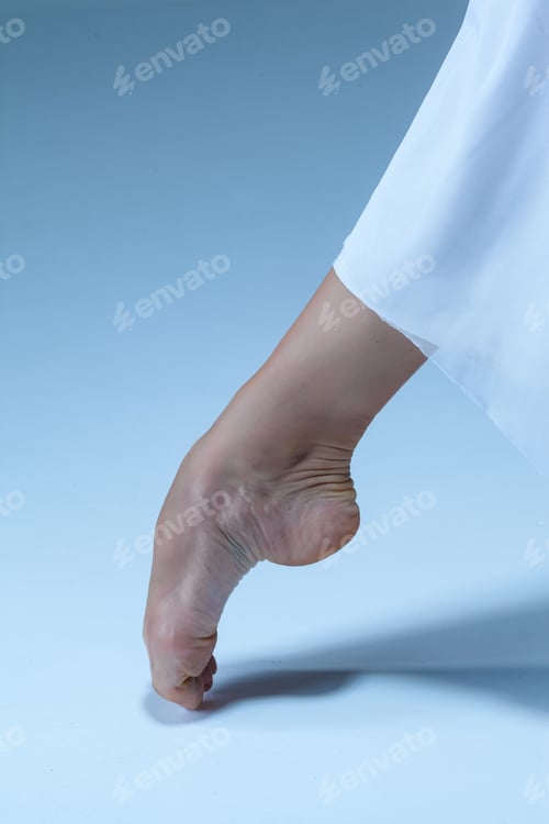 Preview: Close-Up Classic Ballerina'S Leg On The Blue Floor