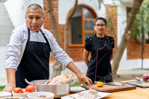Preview: Chef preparing fresh ingredients for outdoor cooking
