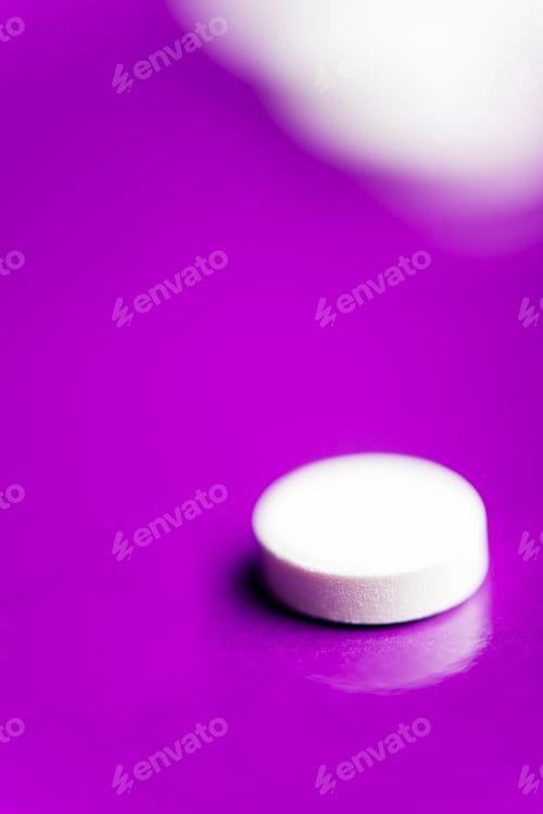 Preview: White pills over a solid lilac background with reflection.
