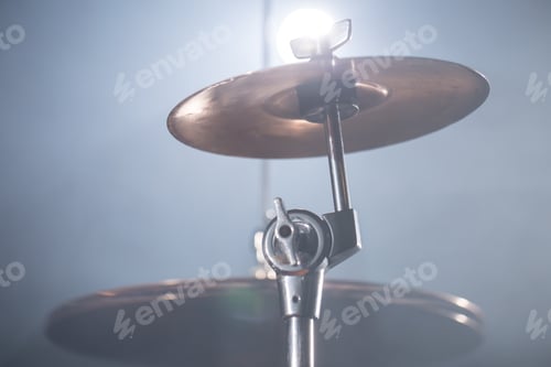 Preview: Close-up Drum set in a dark room against the backdrop of the spotlight.