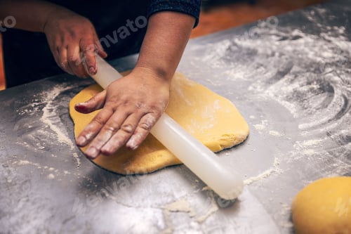 Preview: Woman hand pressing out cookie dough