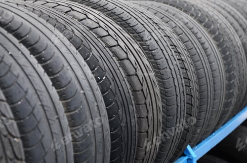 Preview: Rack with variety of car tires in automobile store