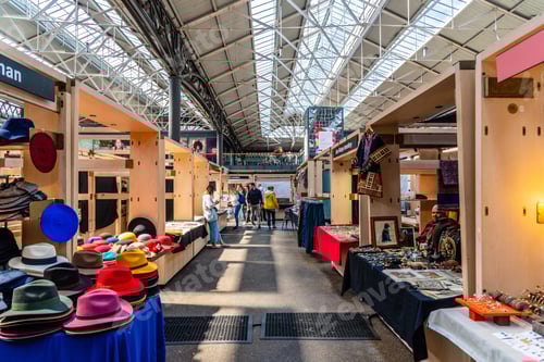 Preview: Indoor Market Scene with Customers and Vendor Stalls