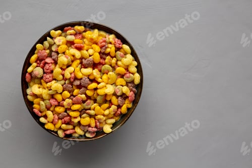 Preview: Fruity Kids Breakfast Cereal with Milk in a Bowl, top view. Copy space.