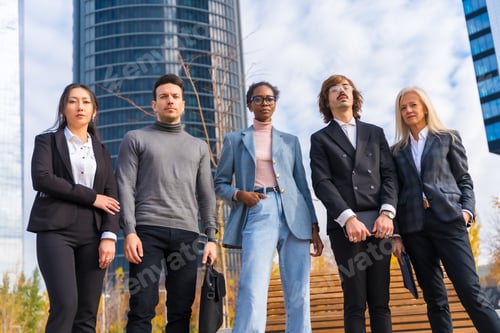Preview: Corporate portrait of group of multi-ethnic businessmen and businesswomen outside offices