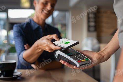 Preview: Woman paying using NFC technology