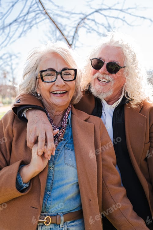 Preview: Joyful seniors sharing a heartfelt embrace while smiling and enjoying precious moments together