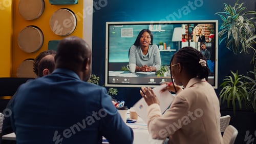 Preview: Project management team attending videocall meeting with shareholders
