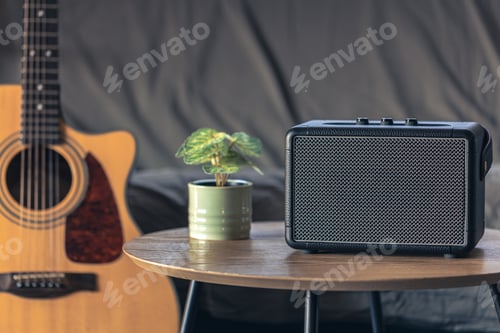 Preview: Close up, music speaker and acoustic guitar in the interior of the room.