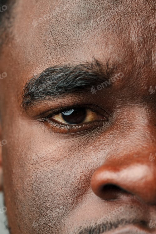 Preview: Close Up of African Mans Face With Brown Eyes