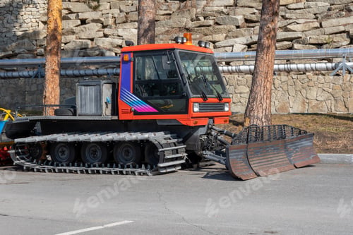 Preview: Snow groomer vehicle with tracks, realistic style, on a road background