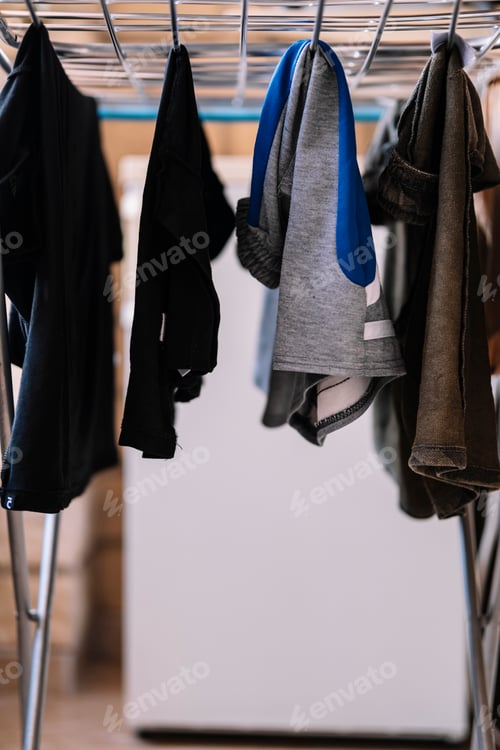 Preview: Clothes hanging on a clothesline inside the house.