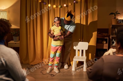 Preview: Black girl performing in home stage play with father