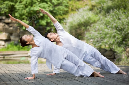 Preview: Young adult practicing yoga