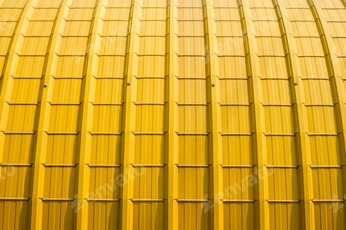 Preview: Sunlight on surface of yellow curve corrugated steel roof background
