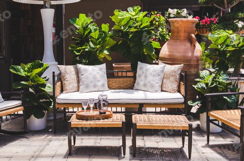 Preview: Comfortable outdoor living space with furniture on a patio and plants