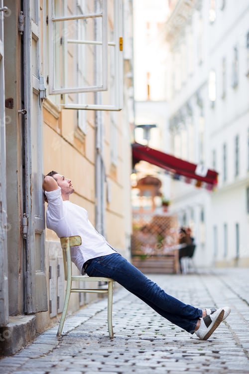 Preview: Young man background the old european city take selfie