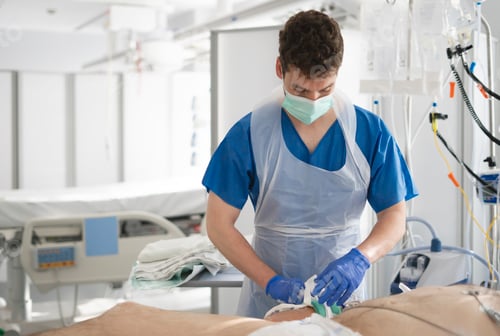 Preview: Nurse cleaning patient's wound in hospital room