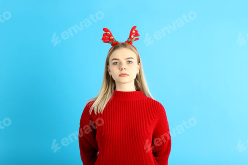 Festive Woman with Antlers and Red Sweater