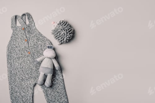 Preview: Knitted romper, wooden toys, teether, crocketed toy. Set of baby stuff and accessories for newborn