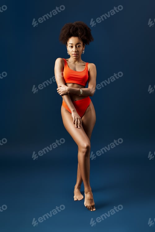 Preview: Vibrant Afro-American Woman Sizzling in Orange Swimsuit