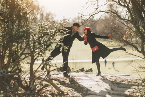 Preview: Couple Having Fun on a Park Pathway in Sunny Autumn Afternoon
