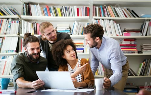 Preview: Working together on project. Happy young business colleagues working in office