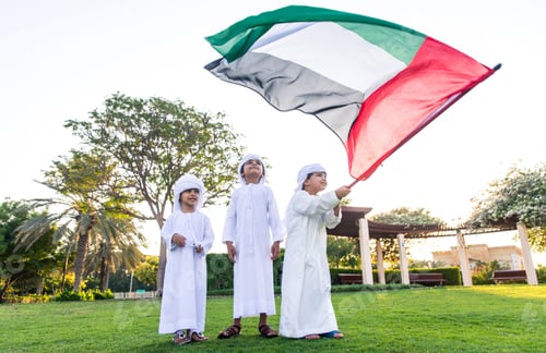 Preview: children playing together in Dubai in the park.