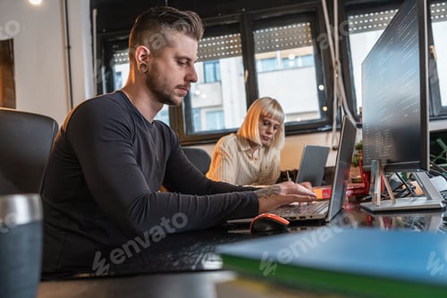 Preview: Group of casual team workers and programmers working on a new project