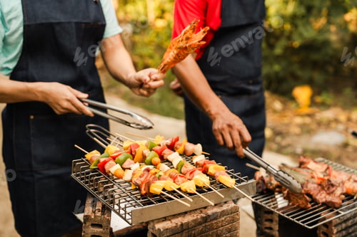 Preview: Skewers with colorful vegetables meat grilling, family friends gathering background, enjoying