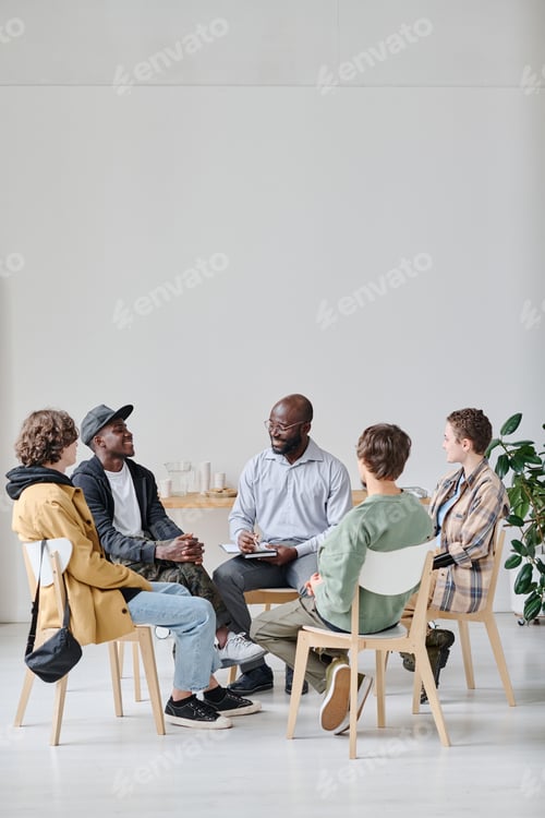 Preview: Students with coach sitting at class